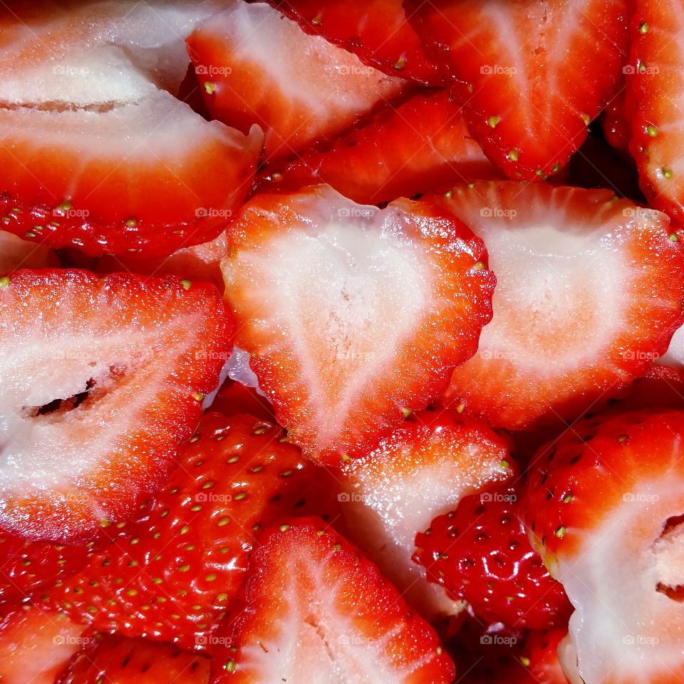 sliced strawberries . sliced strawberries