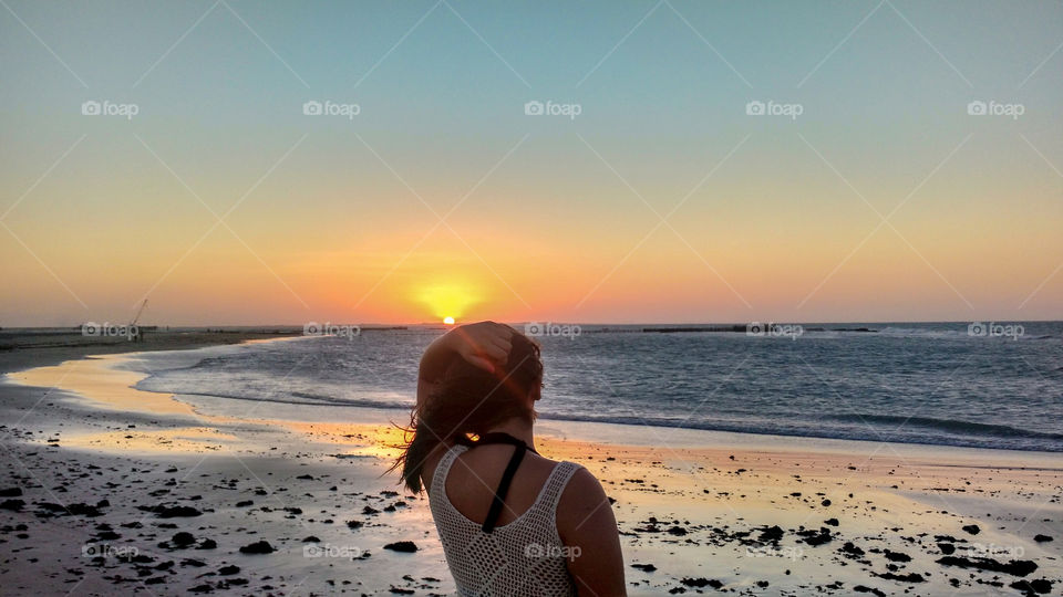 Admiring the sunset on the beach of Paracuru!