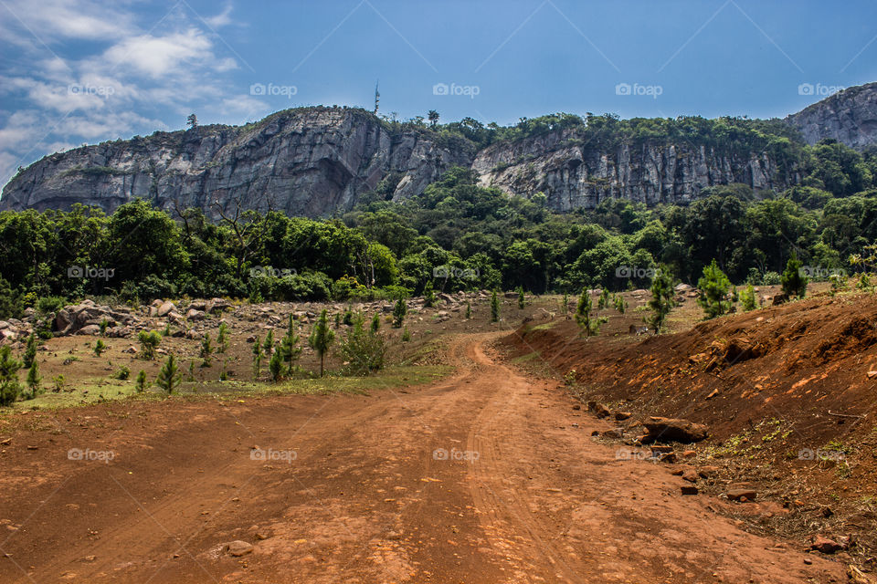 road leading to a mountain range