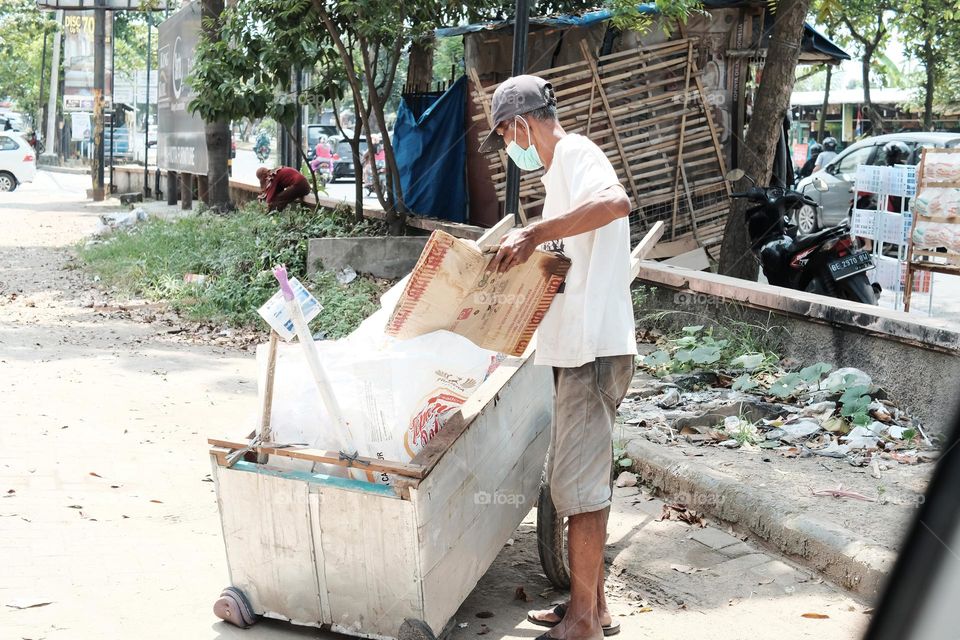 A man loads garbage