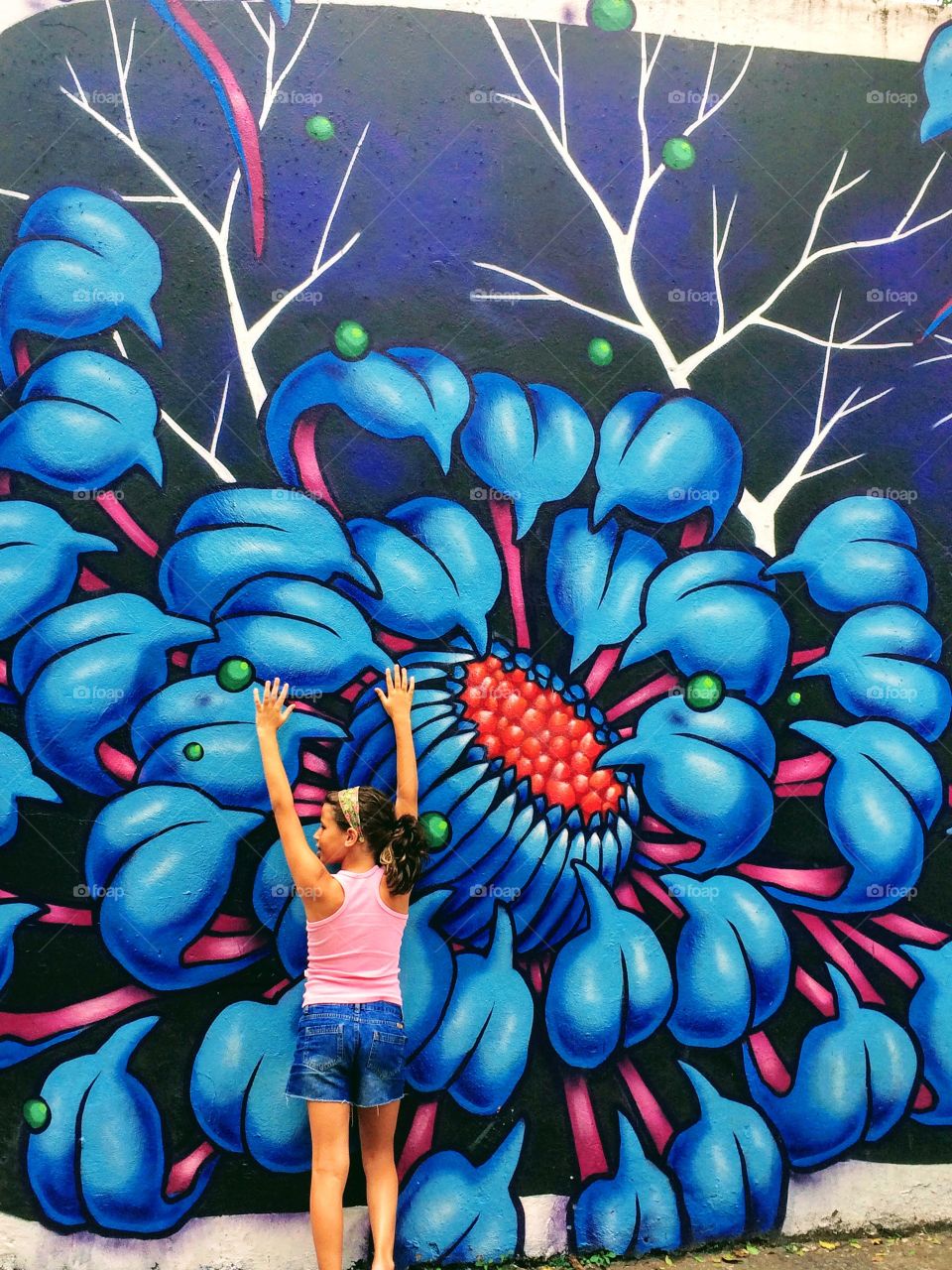 Child in front of a colorful wall