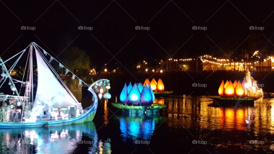 A brilliantly illuminated ship makes its way into Discovery River during Rivers of Light at Animal Kingdom at the Walt Disney World Resort in Orlando, Florida.