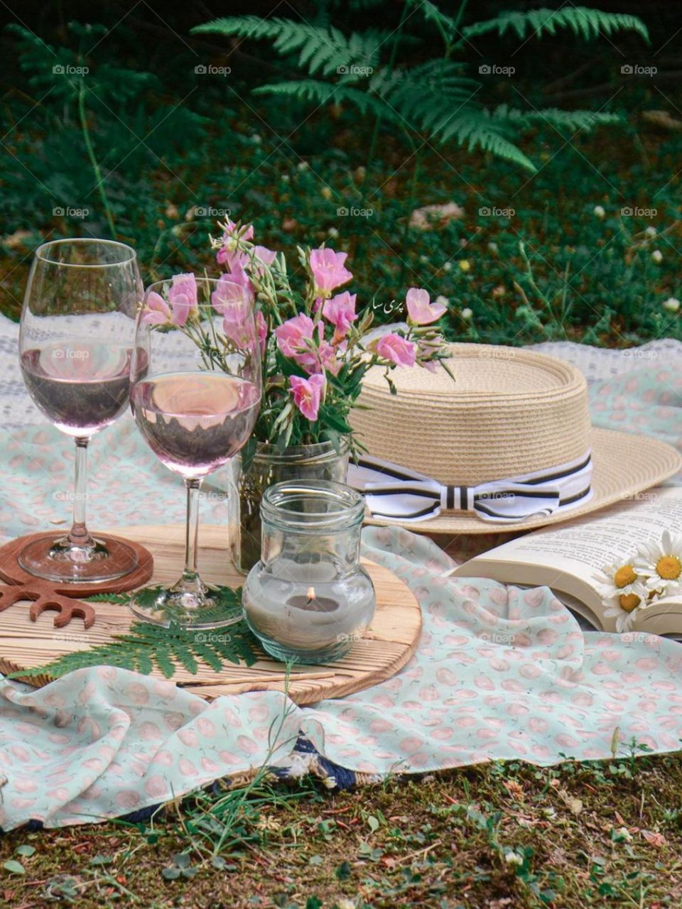 Picnic in summer.... Relaxing beneath the summer sunlight, reading your favorite book, enjoying snacks and drinks and enjoying the nature... Memorable and enjoying