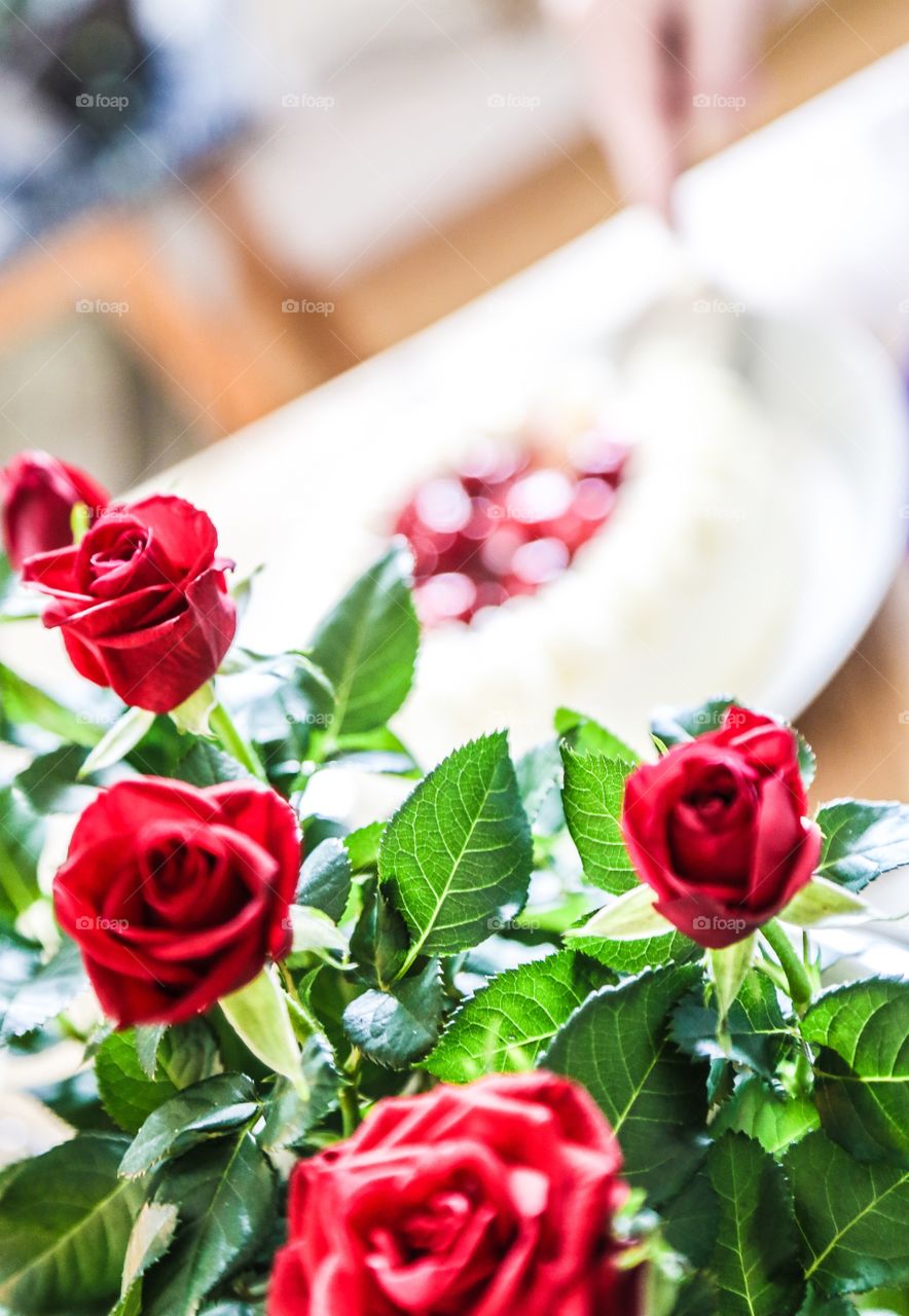 Roses and strawberry cake. Red roses and strawberry cake