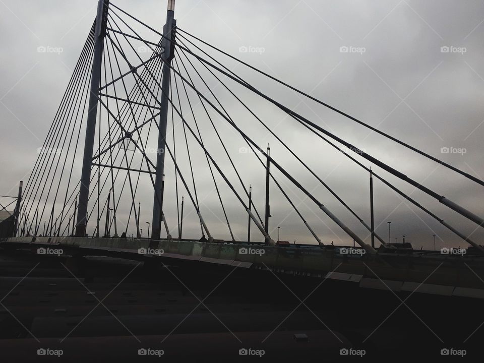 Iconic Mandela bridge and cloudy skies.