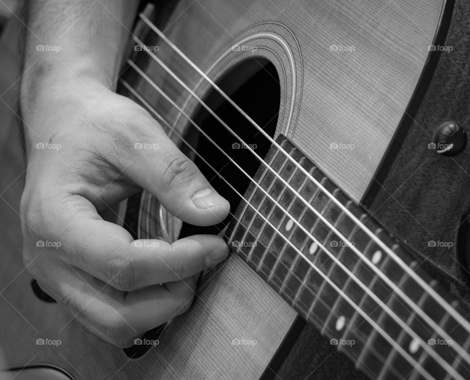 Guitarist’s playing music on the stage