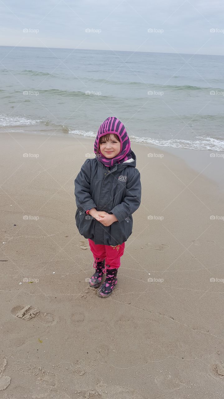 Girl standing on beach