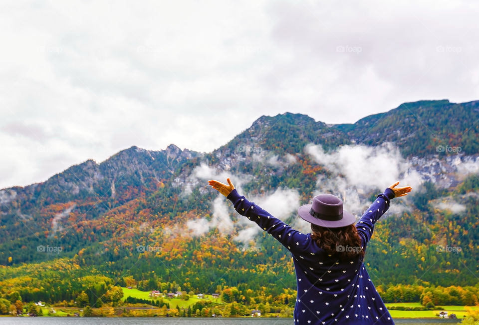 Fashionable female tourist person enjoy nature in fall