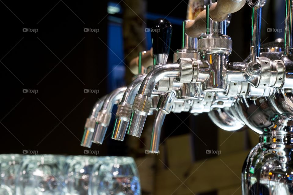 Beer taps in the pub. Zilina, Slovakia