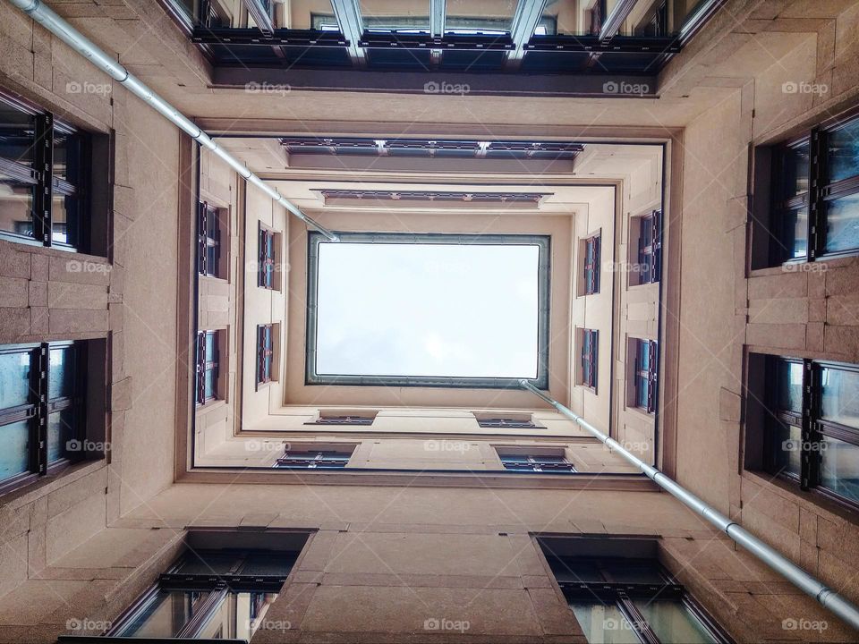 view of the Sky from bottom to top from a courtyard