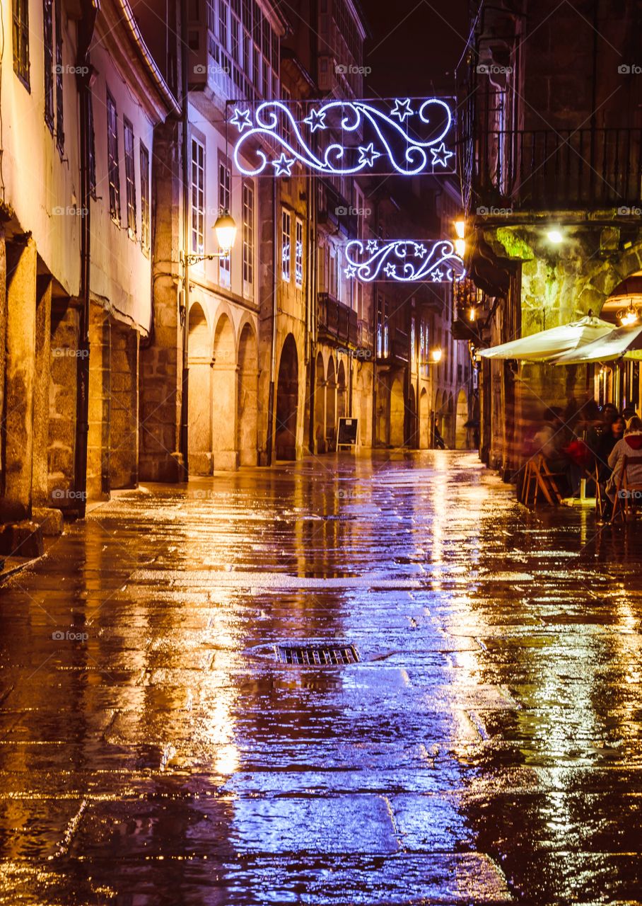 Christmas lights reflection on a rainy day