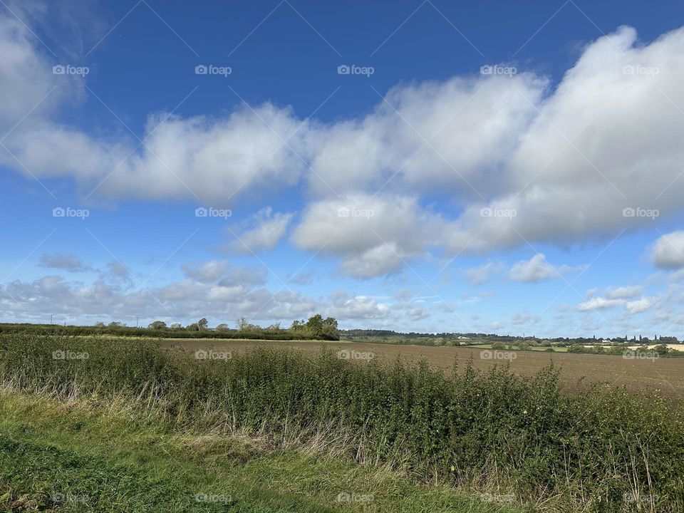 Mid-morning narrowboat cruise on Oxford canal between Barby and Onley clear sunny sky lovely late summer weather vacation holiday English country farms fields