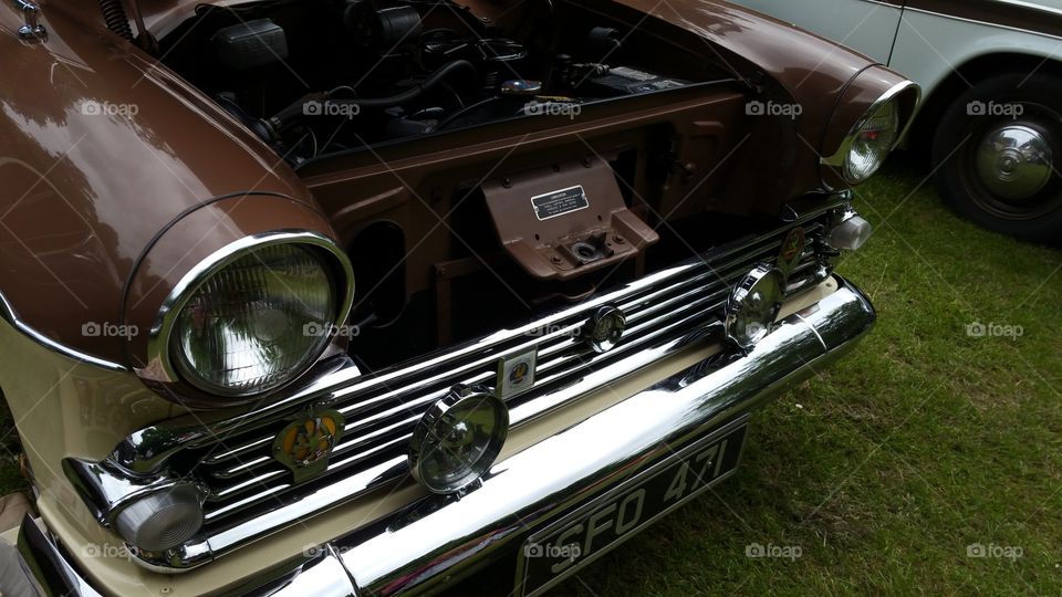 Brown vintage car with the bonnet up