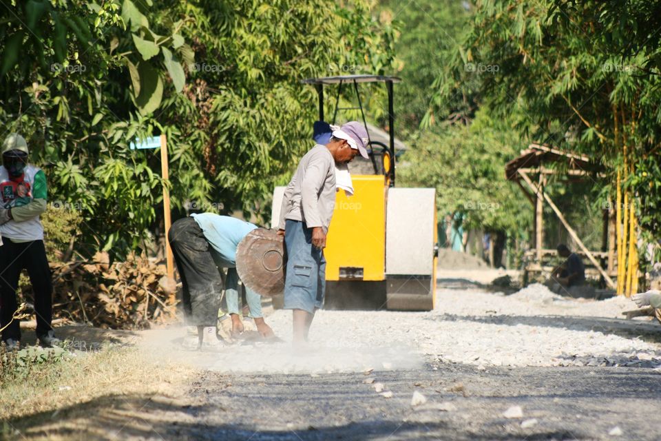 repairing road in indonesia