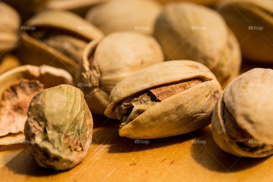Macro - delicious pistachio nuts in and out of shell close-up