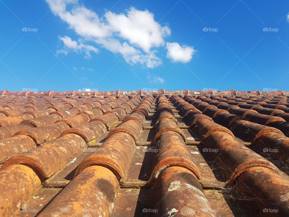 Orange tiles roof, blue sky background