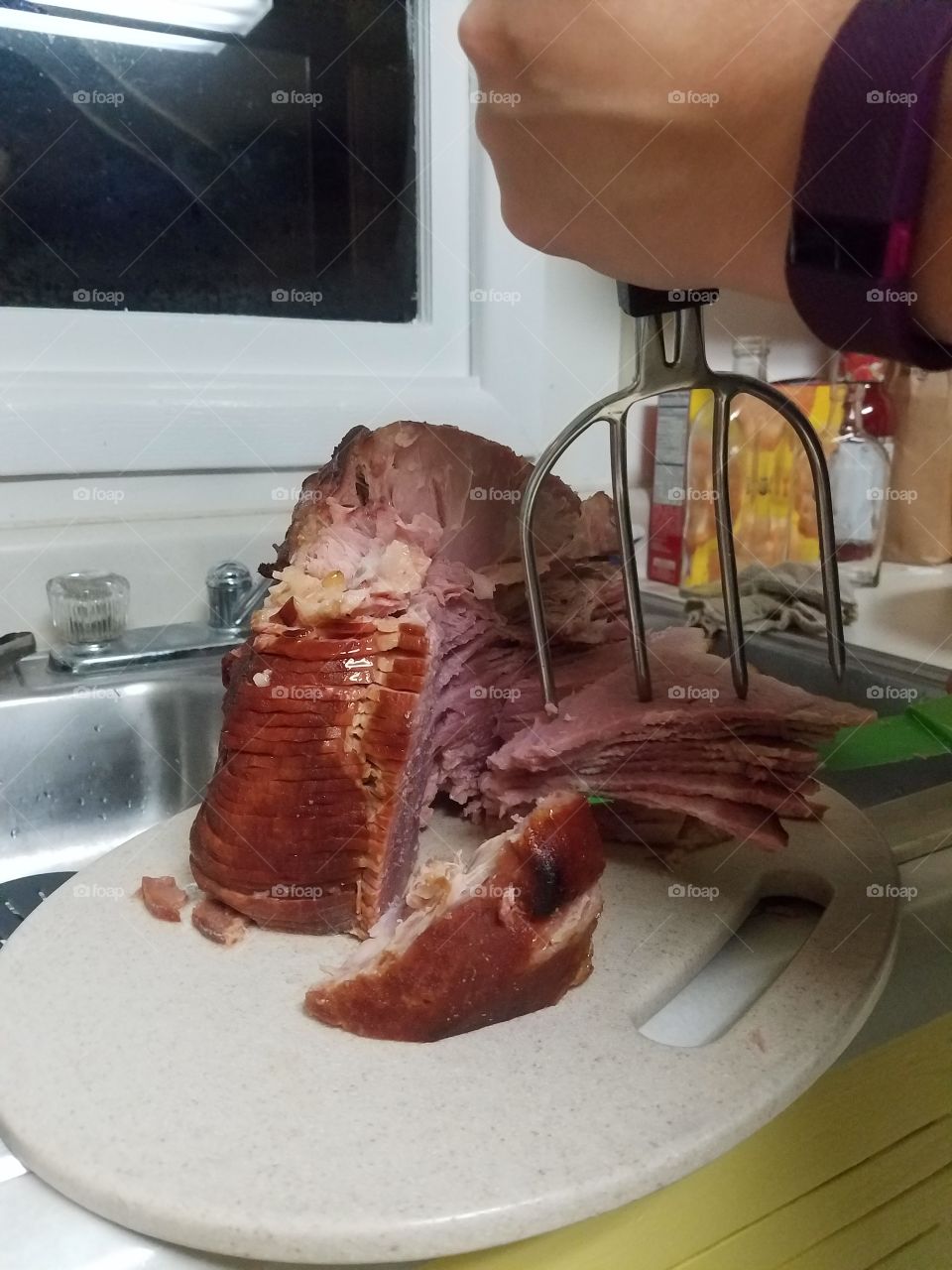 carving the Christmas ham
