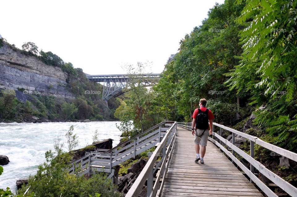 Man walking at riverside