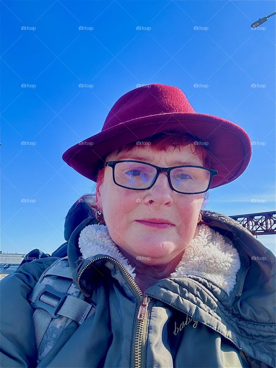 This is me, „Petra Schiller“ a.k.a. „Maxine Firefox“ crossing the „Pulaski Bridge“ at „Newtown Creek“ that connects LIC, Queens to „Greenpoint“, Brooklyn with a brisk wind hitting me in the face. 2024. Hypnotic Productions