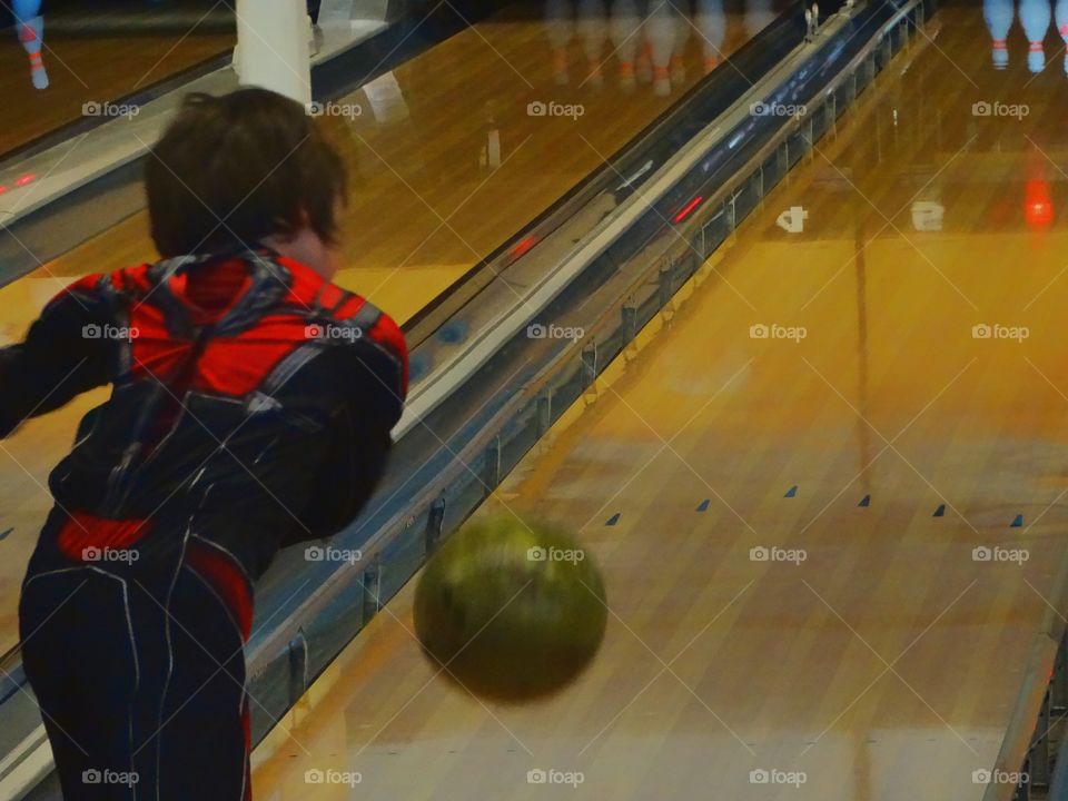 Young Boy Bowling