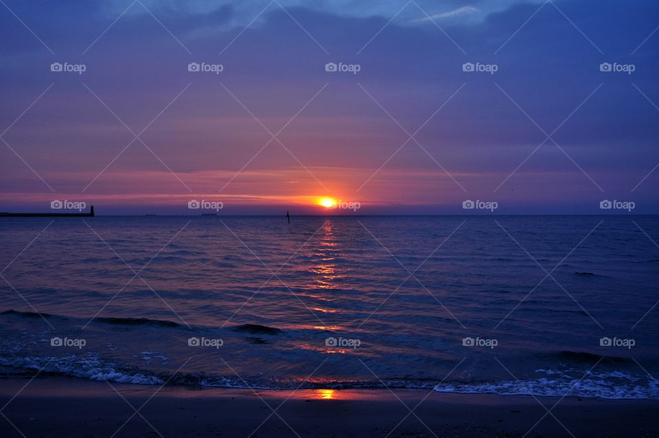 purple sunrise over the Baltic sea in Poland