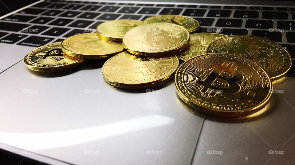 Close up on Gold bitcoin on keyboard 