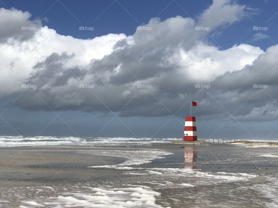 After a rare summer storm, the local lifeguard was all alone at the beach... well, what’s left of the beach.