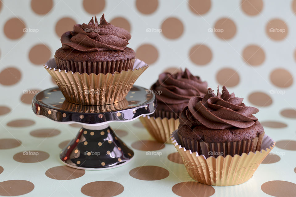 Chocolate cupcake on cupcake stand