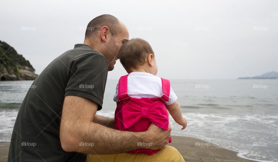 father and daughter looking in the same direction