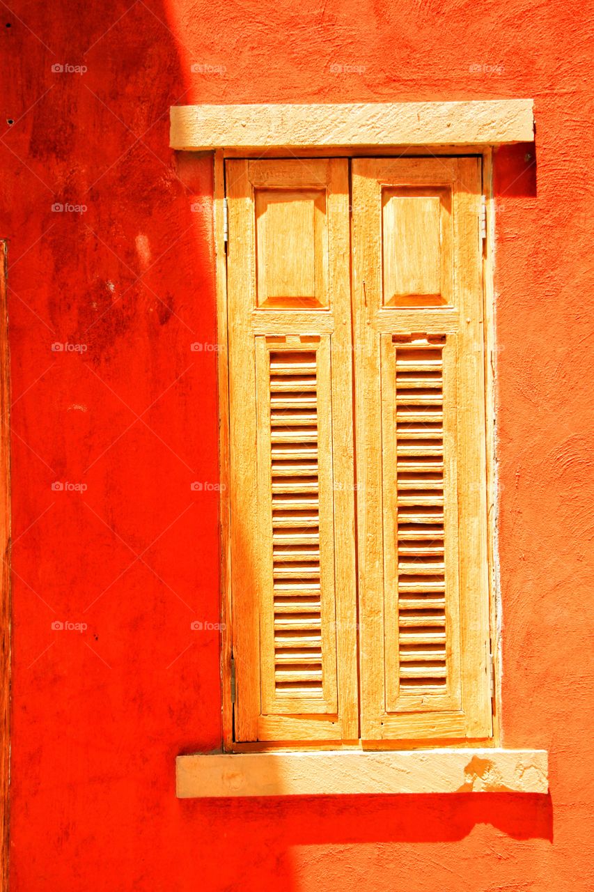 Lights and shadows on the orange wall.