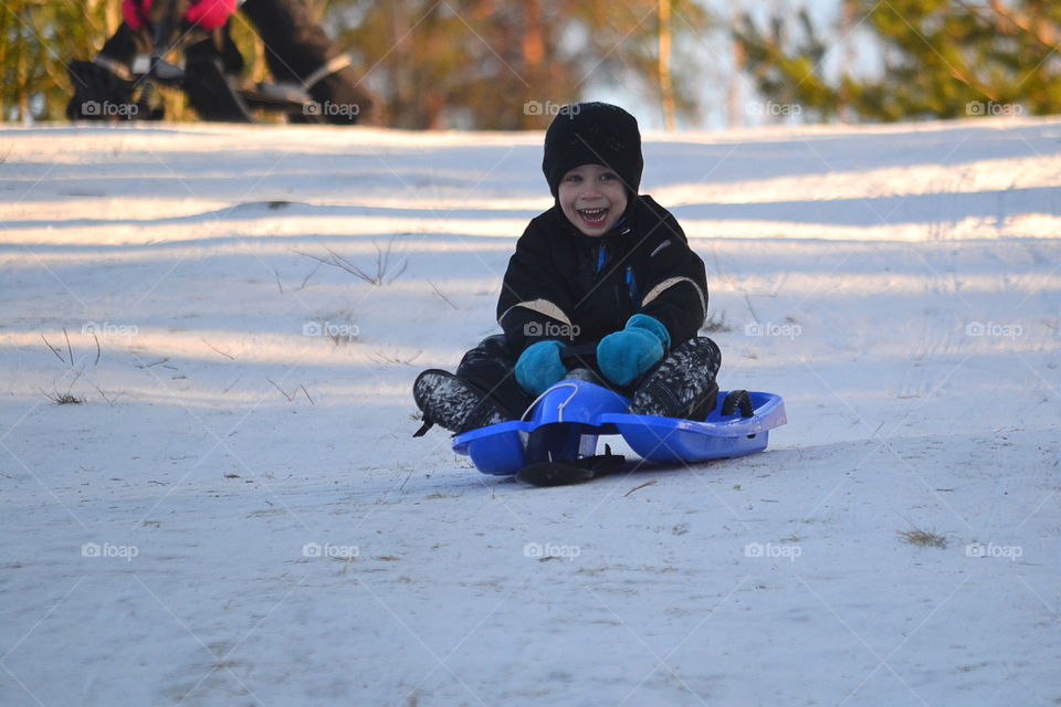 Boy sledding