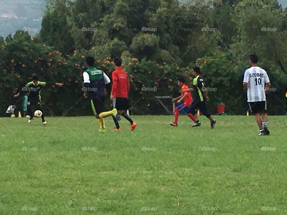 Soccer season is on..... The striker trying his best shot in the game  between  school teams.. Pressure is something you feel when you don't know what the hell you're doing.