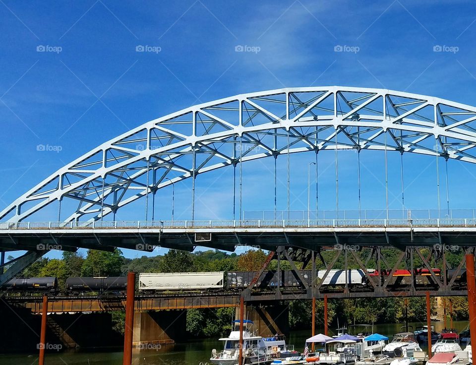 the beginning of the second train crossing the bridge