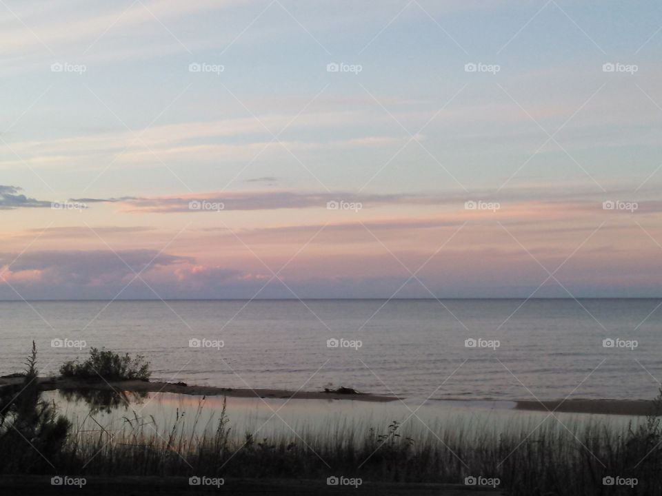 Setting Sun. the sun beginning to set over lake huron