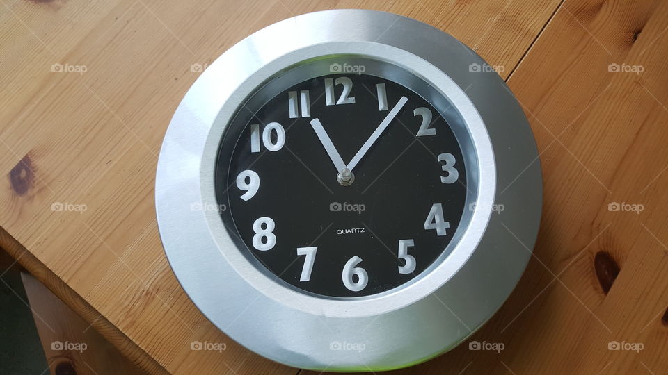 clock on table before hanging it up on the wall