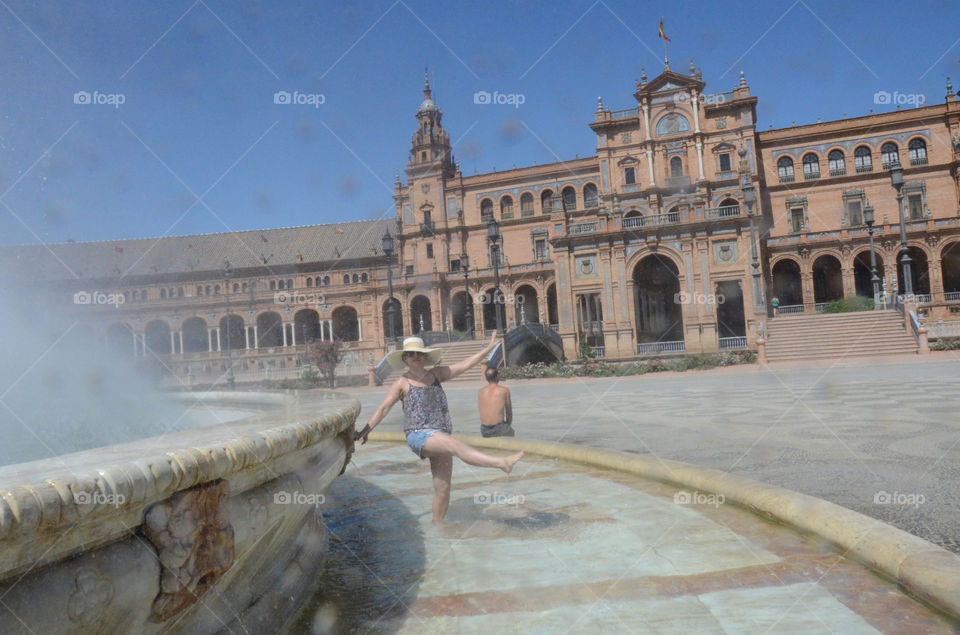 Happy tourist in Plaza di Espagna, Seville
