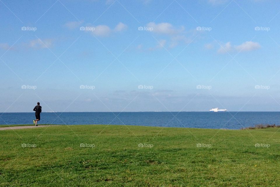 Jogger by the ocean.