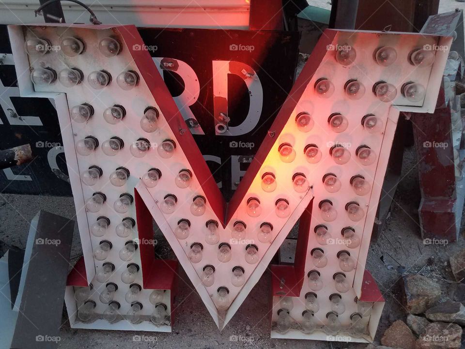 an old neon "M"