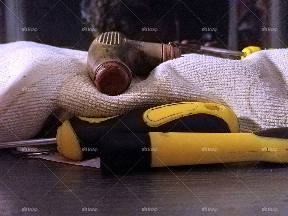 two screw drivers with that a thing and a old towel on my window sill at night