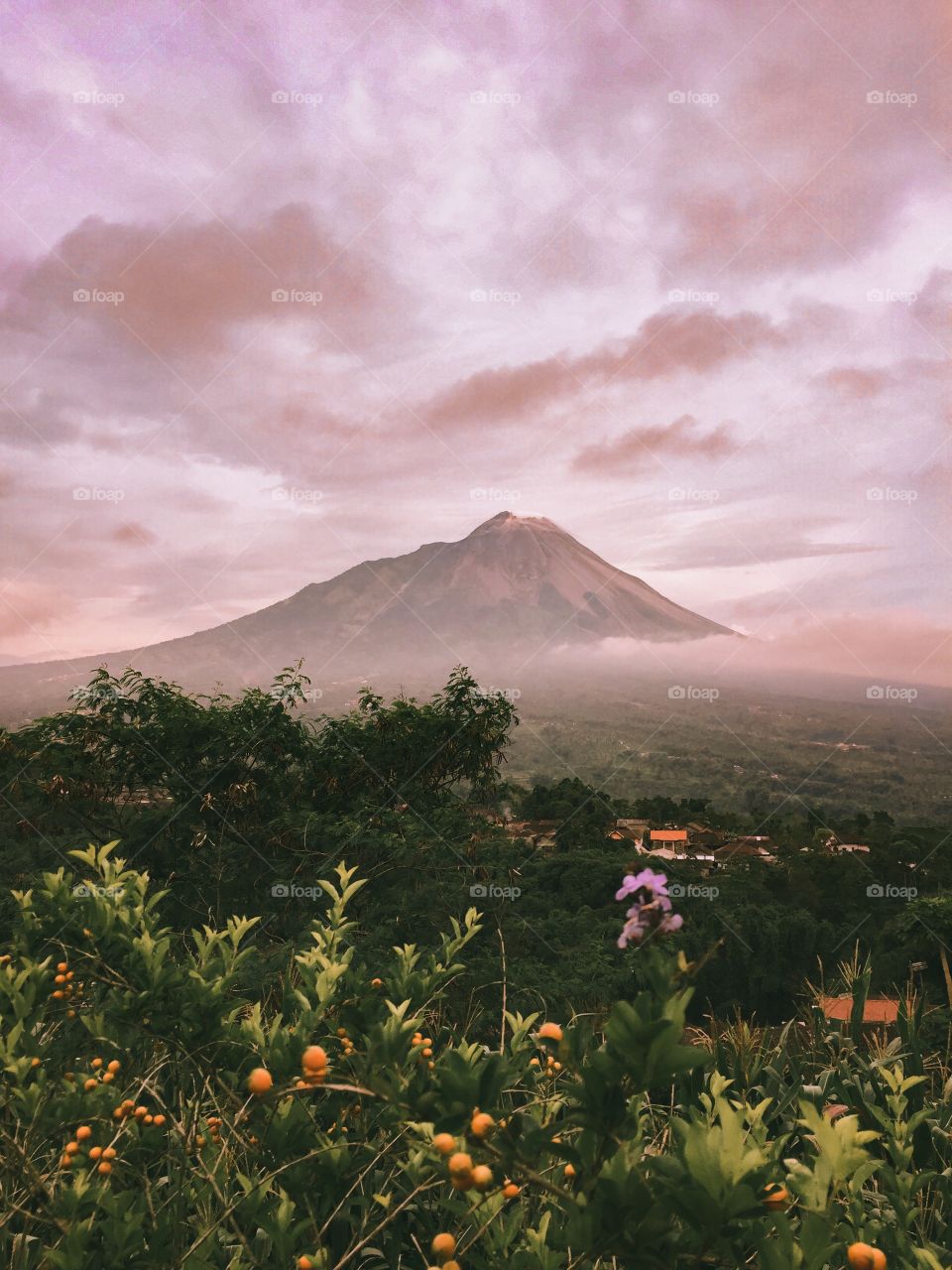 the atmosphere of the sunset behind Mount Merapi