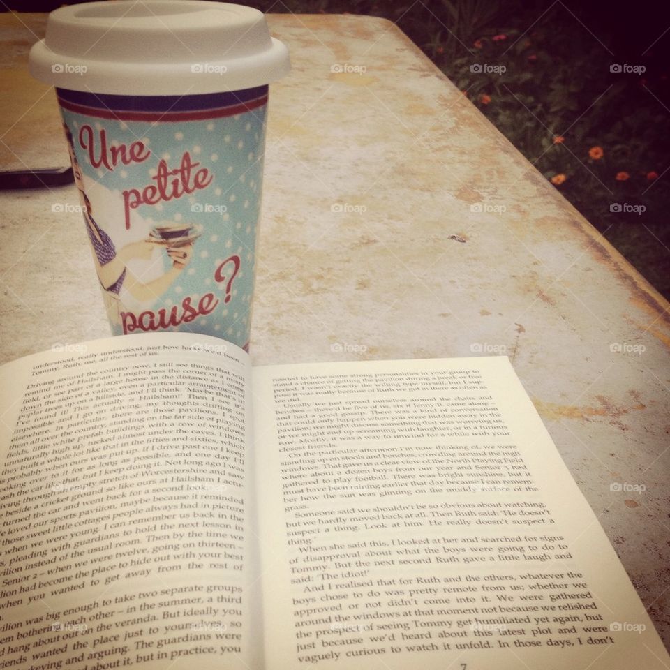 Drinking a coffee in the garden, with a lovely book