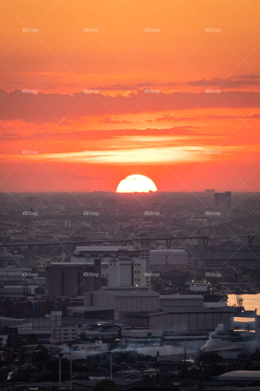 Big sunset in the middle of Bangkok city