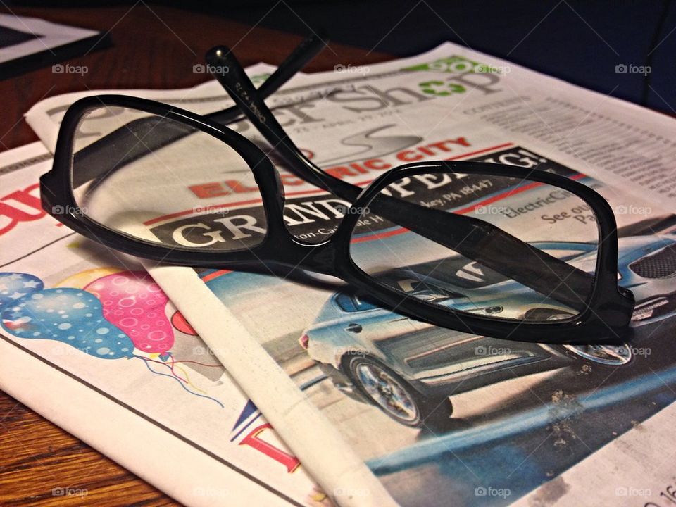 Reading glasses and paper