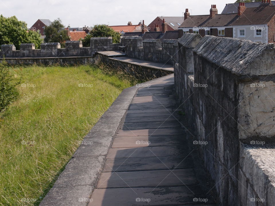 The historic fortified York Wall made of massive stone and a nice walkway surround the older parts of the city. 