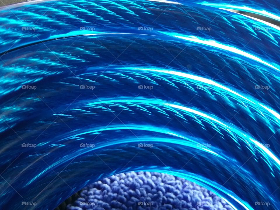 Blue lock cable against microfiber fabric.