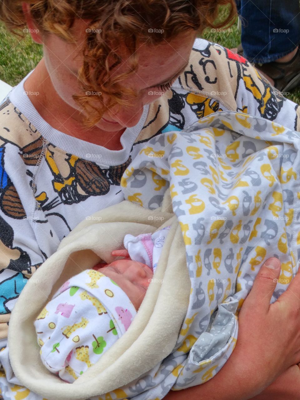 Young Girl Holding A Newborn Baby
