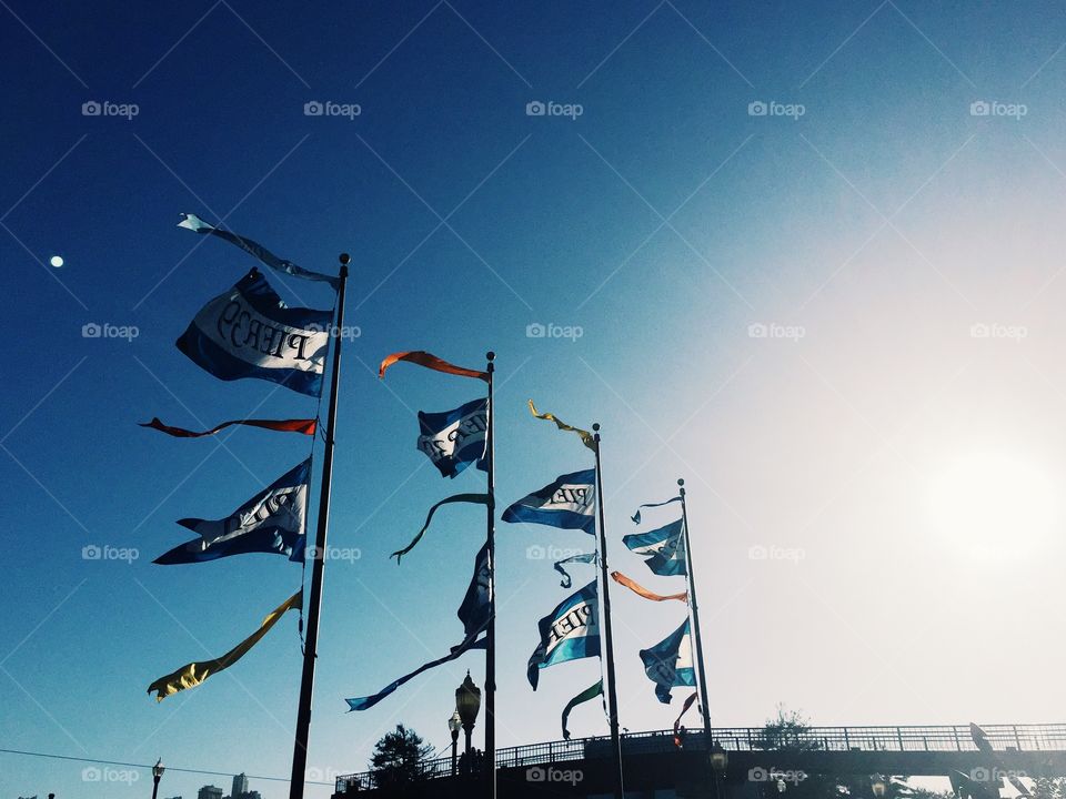 Proud flags by the pier
