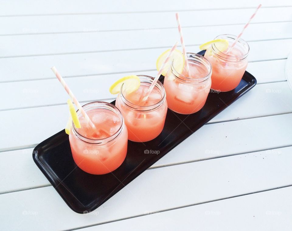 Cocktail in glass jars on table