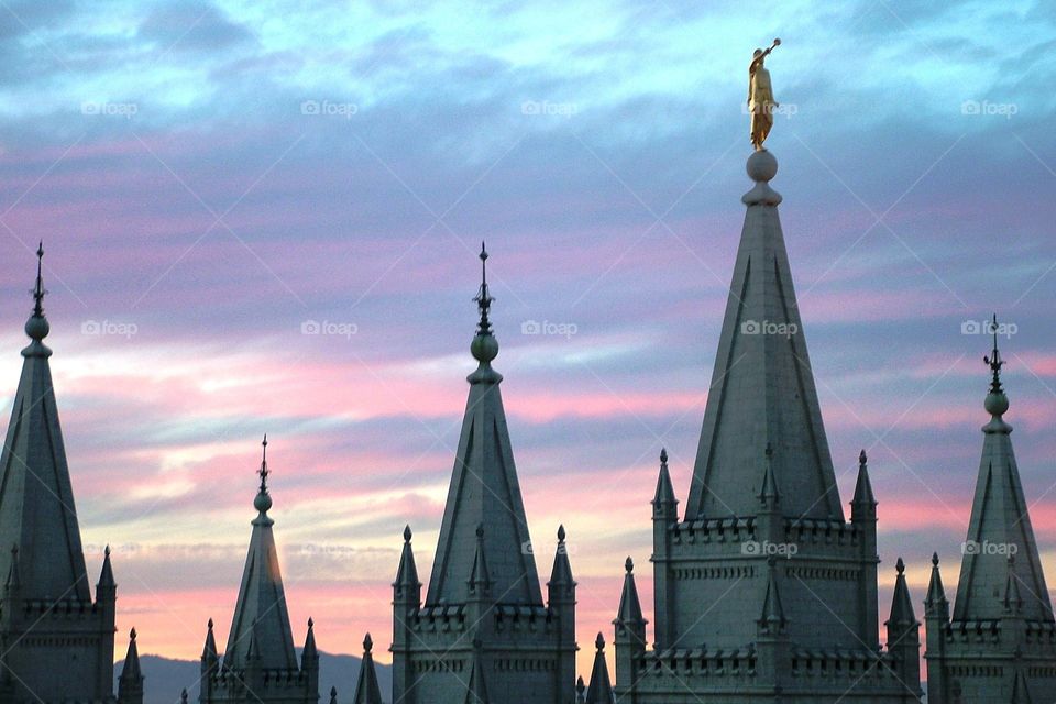 The Salt Lake LDS Temple at late sunset with soft pastelic colors in the background