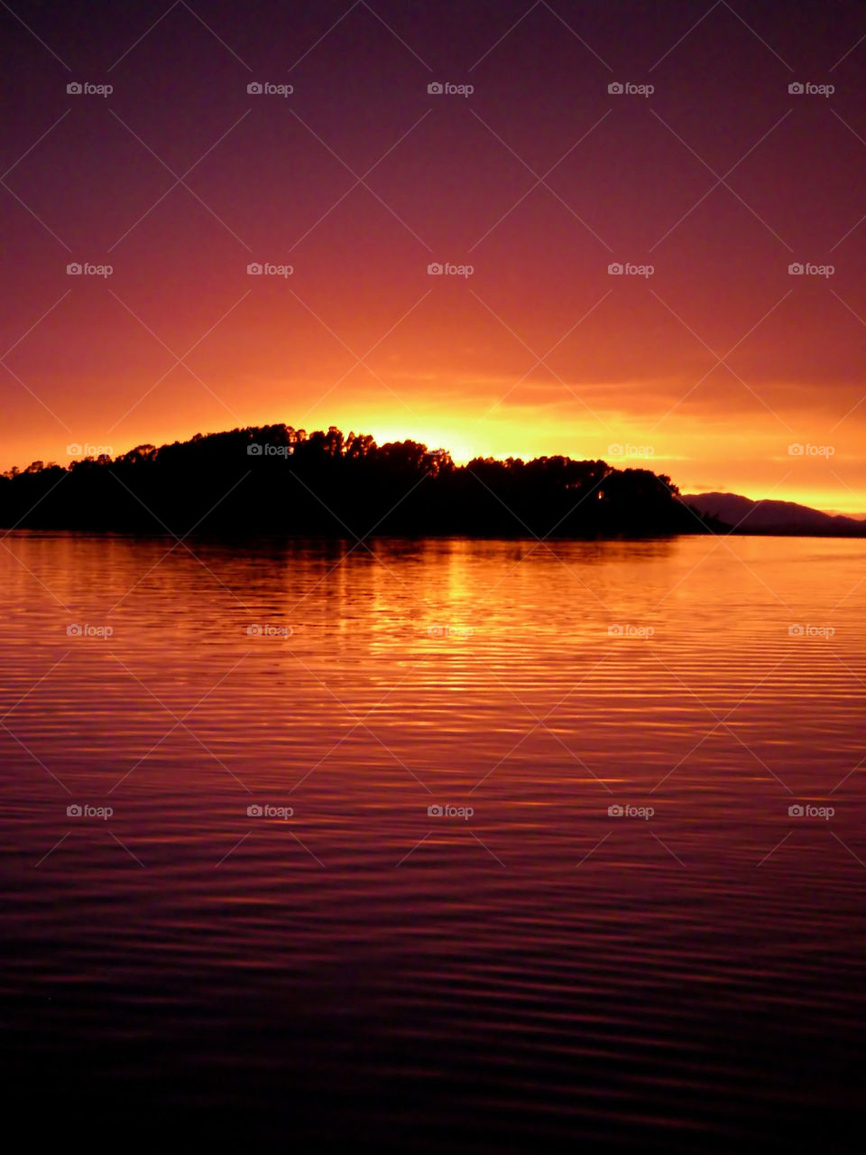 sunset in Norway at the coast with island